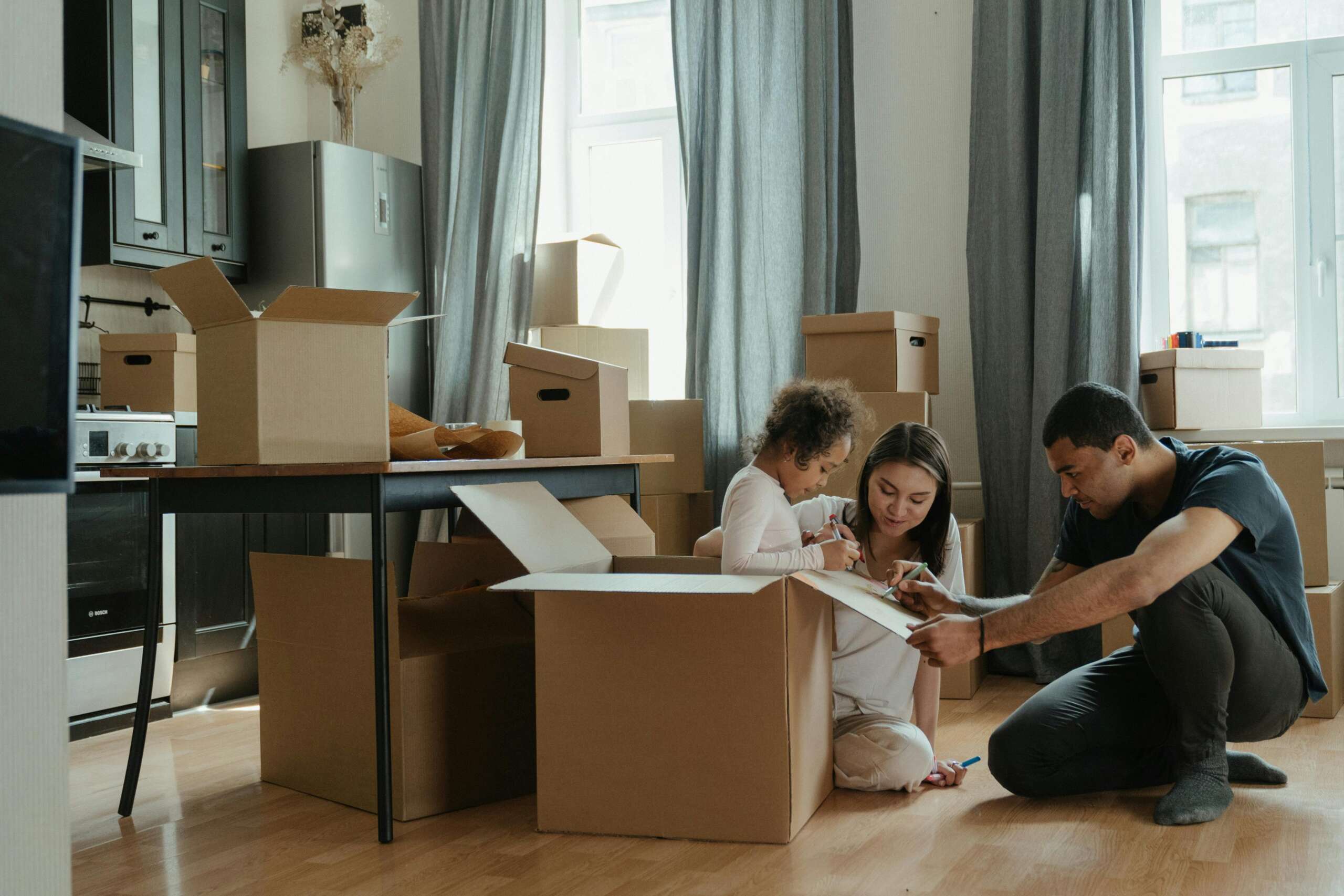 Affordable Movers Affordable movers loading furniture into a moving truck for a budget-friendly relocation service